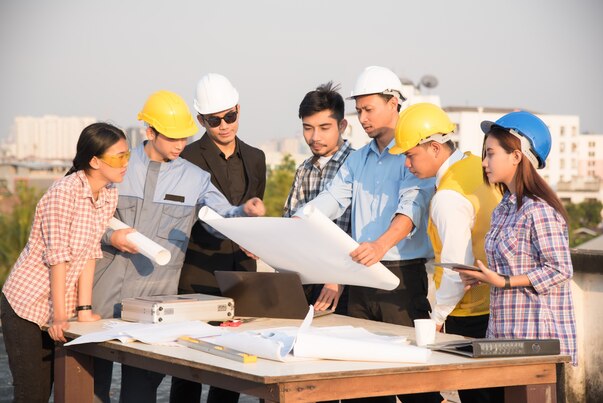 group-engineers-architects-discuss-construction-site_1357-437